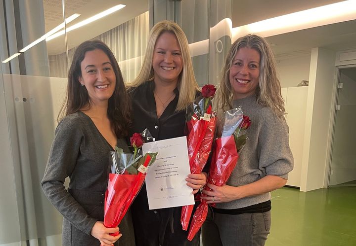 Image of Michelle, Kathryn, and Andrea receiving the grant award